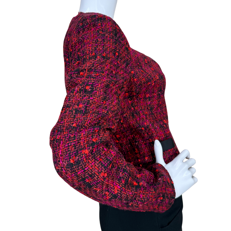 Load image into Gallery viewer, Red and black patterned sweater on a mannequin against a white background
