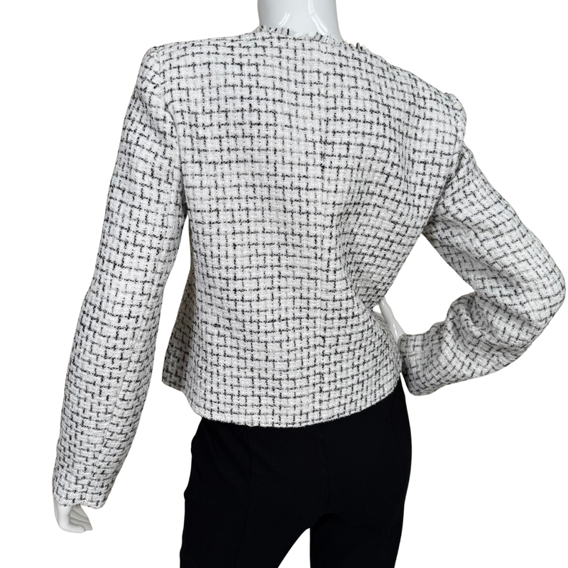 Load image into Gallery viewer, Black and white checkered jacket on a mannequin against a white background
