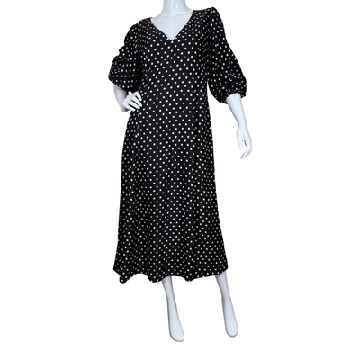 Kate Spade Black Polka Dot Maxi Dress features a classic white polka dot print and a flattering V-neckline