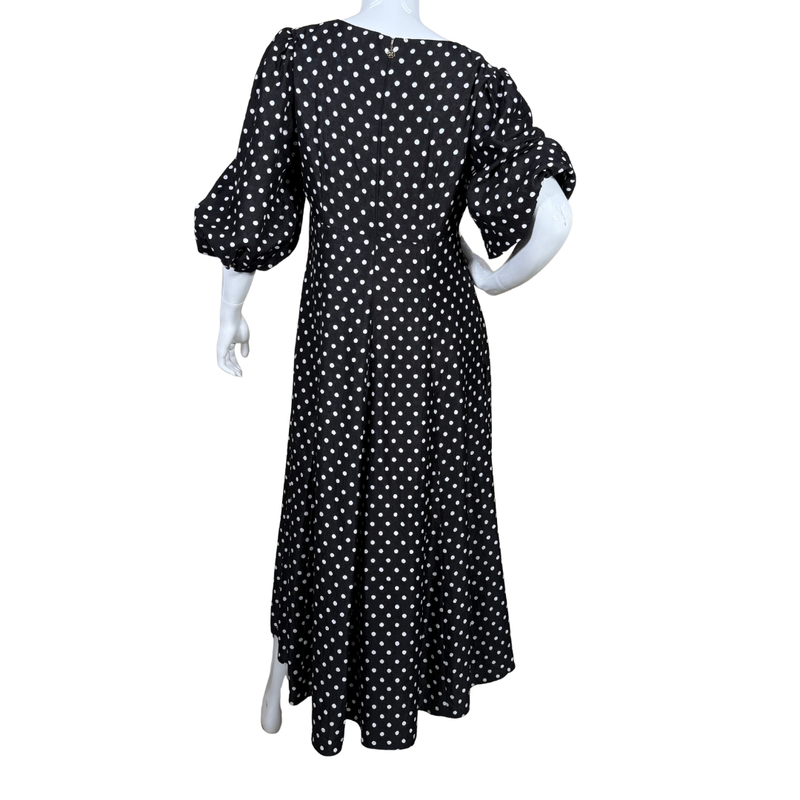 Load image into Gallery viewer, Black dress with white polka dots on a mannequin against a white background
