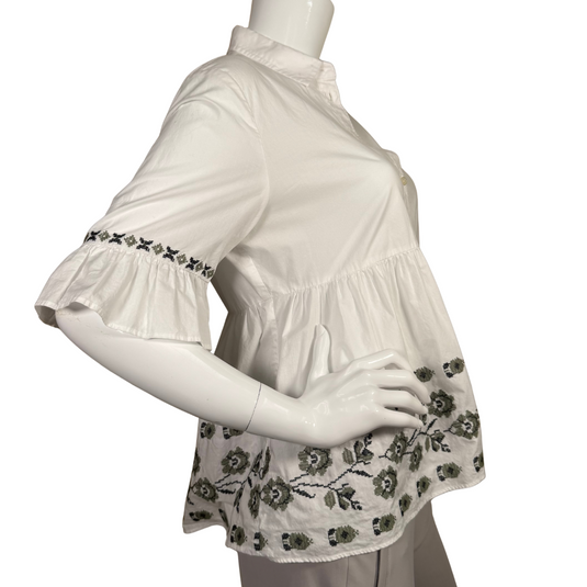 Kate Spade Broome Street White Blouse with Embroidered Flowers is a stylish and feminine piece featuring a button-down front with a classic collared neckline