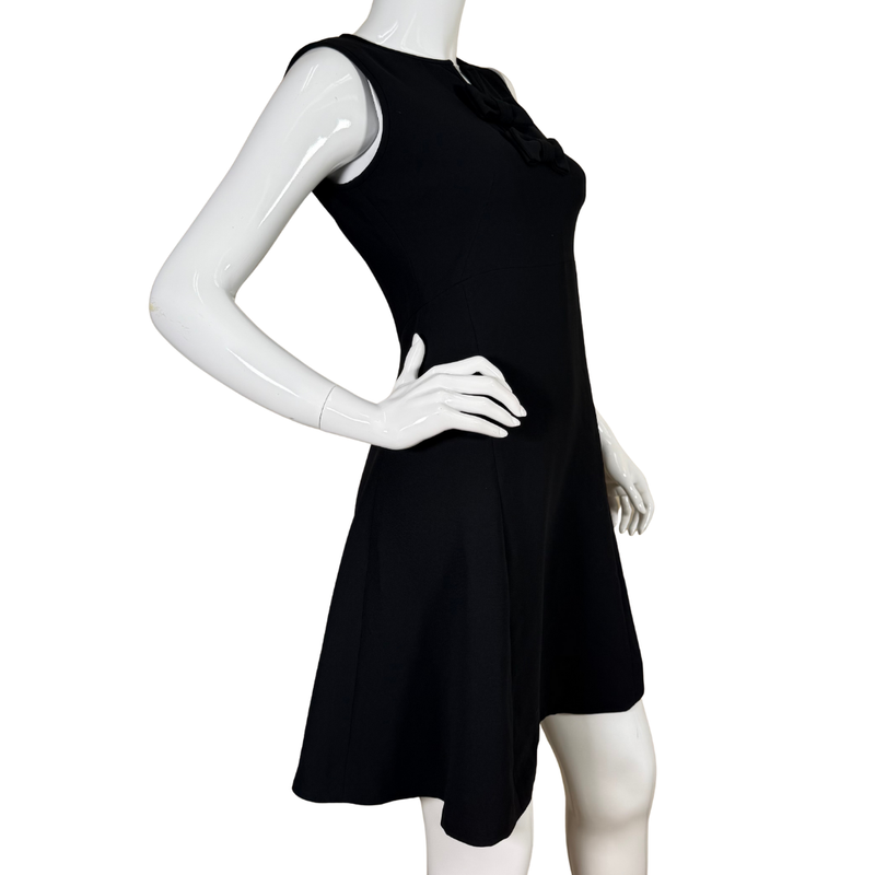 Load image into Gallery viewer, sleek Kate Spade Elegant Black Dress with Double Bow offers effortless sophistication with its gently flared A-line cut and elegant double bow detail at the neckline
