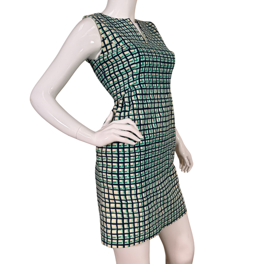 Mannequin wearing a green checkered dress on a white background
