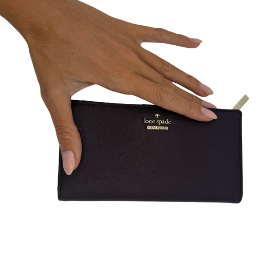 Timeless and refined, this Kate Spade Plum Continental Wallet is designed for both functionality and fashion.