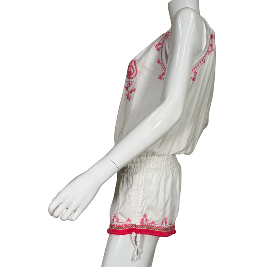 casual and playful donated Lani Lau White and Pink Boho Embroidered Romper is crafted from lightweight white fabric and adorned with vibrant pink embroidery