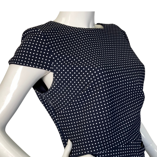 Ralph Lauren Polka Dots Navy Blue Dress is a fitted, knee-length design with short sleeves and a high, rounded neckline - side view close up