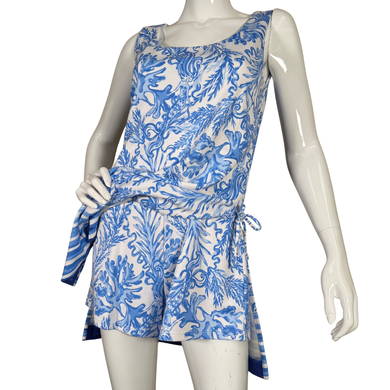Bright and breezy, this sleeveless pre-loved Lilly Pulitzer Blue and White Mermaid Themed Overall Dress features a vivid blue botanical and coral reef-inspired print on a crisp white background