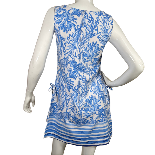 Mannequin wearing a blue and white patterned dress on a white background