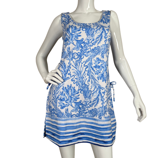 Blue and white patterned dress on a mannequin against a white background