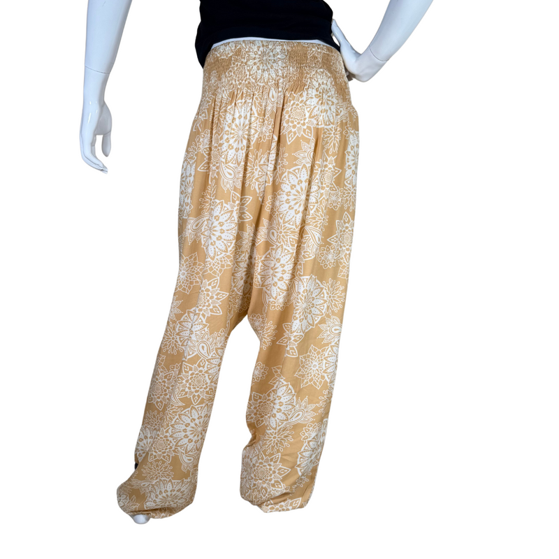 Load image into Gallery viewer, relaxed-fit donated Lotus And Luna Beige Boho Pants feature a warm mustard yellow base adorned with an intricate white mandala floral print

