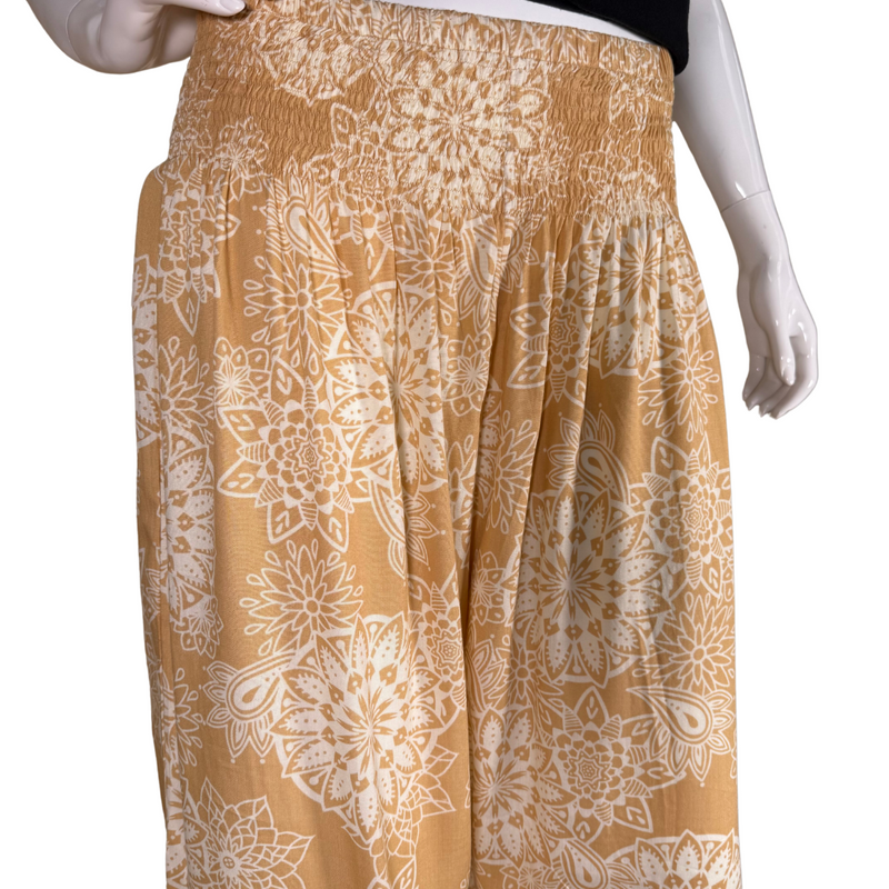 Load image into Gallery viewer, relaxed-fit donated Lotus And Luna Beige Boho Pants feature a warm mustard yellow base adorned with an intricate white mandala floral print
