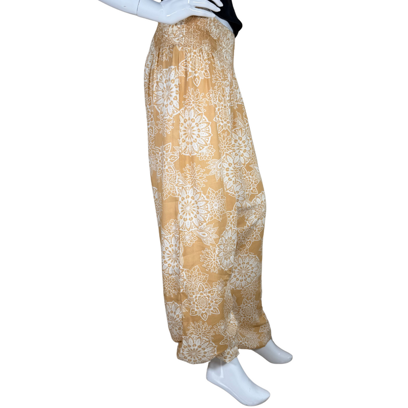 Load image into Gallery viewer, relaxed-fit donated Lotus And Luna Beige Boho Pants feature a warm mustard yellow base adorned with an intricate white mandala floral print
