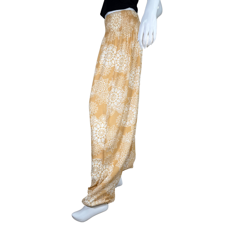 Load image into Gallery viewer, relaxed-fit donated Lotus And Luna Beige Boho Pants feature a warm mustard yellow base adorned with an intricate white mandala floral print
