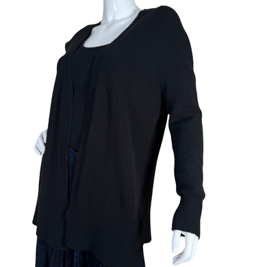Madewell Opened Classic Black Knit Cardigan. Crafted from a soft, textured fabric, it boasts a flattering open-front design that makes layering effortless