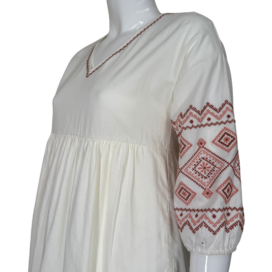 pre-loved Madewell White Boho Cotton and Linen Midi Dress features a relaxed, flowing silhouette with a gathered empire waist for a comfortable fit