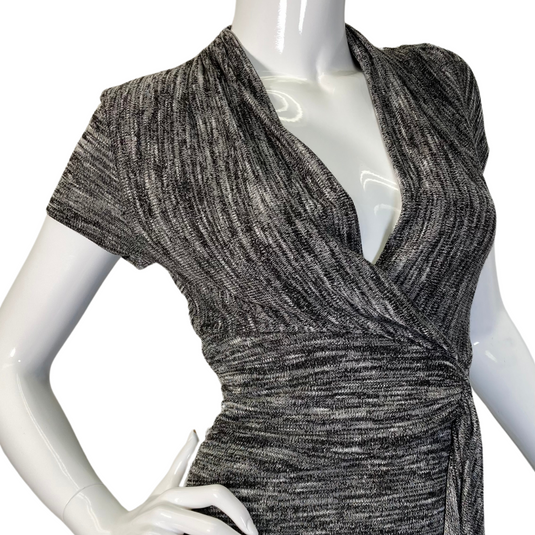 A sleek and stylish Maeve Knitted Dress with V-Neck and Cinched Waist in a textured gray fabric - close up view