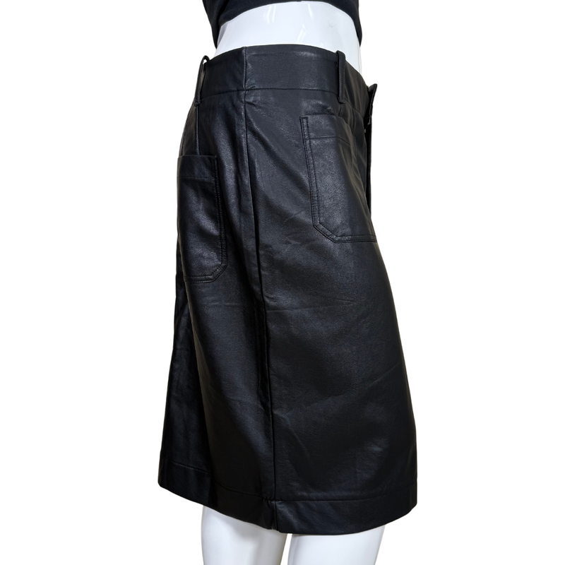 Load image into Gallery viewer, Black leather skirt on a mannequin against a white background
