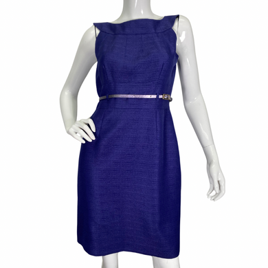 Tahari Elegant Royal Blue Dress is a chic and sophisticated sleeveless sheath dress. It features a structured bateau neckline that adds a touch of elegance, complemented by subtle pleating on the bodice for a tailored fit - front view