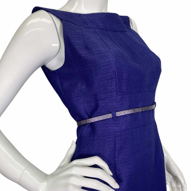 Load image into Gallery viewer, Tahari Elegant Royal Blue Dress is a chic and sophisticated sleeveless sheath dress. It features a structured bateau neckline that adds a touch of elegance, complemented by subtle pleating on the bodice for a tailored fit - side view - close-up
