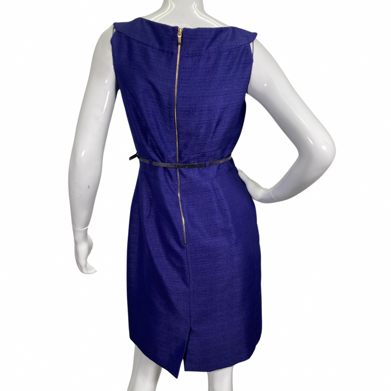 Load image into Gallery viewer, Tahari Elegant Royal Blue Dress is a chic and sophisticated sleeveless sheath dress. It features a structured bateau neckline that adds a touch of elegance, complemented by subtle pleating on the bodice for a tailored fit - backside view 
