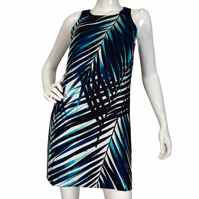 Trina Turk Shades of Blue Sleeveless Dress vibrant sleeveless shift dress showcases a striking tropical palm leaf pattern in shades of navy, teal, and white, evoking a fresh and breezy aesthetic front view