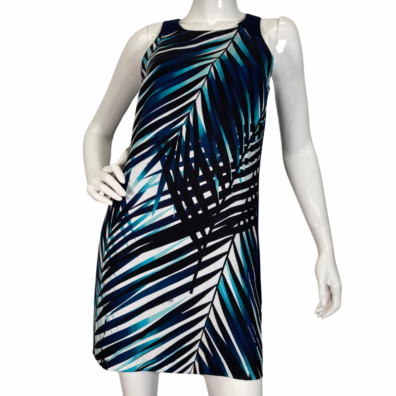 Load image into Gallery viewer, Trina Turk Shades of Blue Sleeveless Dress vibrant sleeveless shift dress showcases a striking tropical palm leaf pattern in shades of navy, teal, and white, evoking a fresh and breezy aesthetic front view
