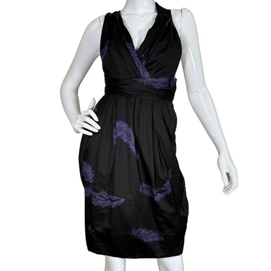 Marc Jacobs Black Neck Wrap Dress with Purple Feathers features a deep V-neckline with a flattering wrap-style bodice