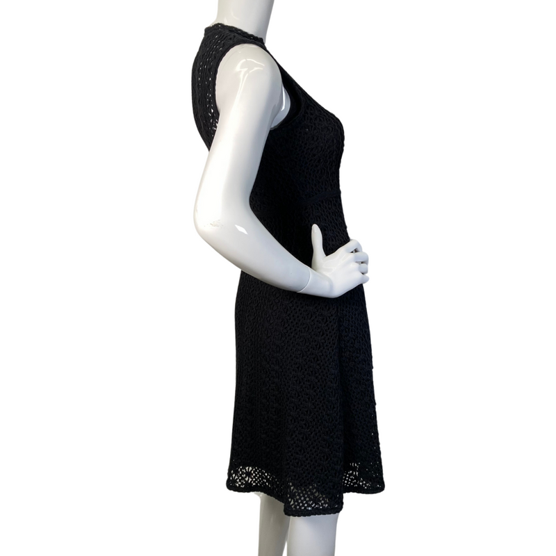 Load image into Gallery viewer, This Meadow Rue by Anthropologie Black Lace Knit Dress is a sleeveless, knee-length piece with a fitted silhouette - side view
