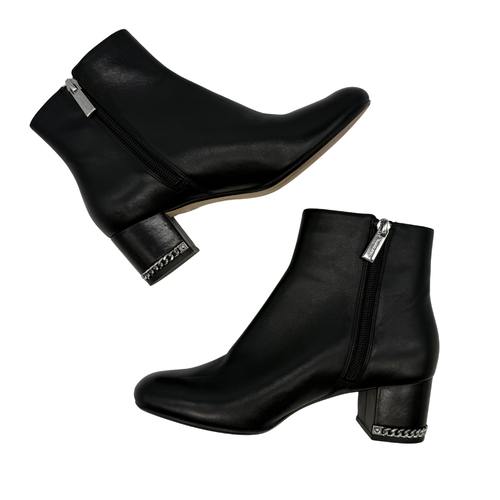 Michael Kors Black Leather Ankle Boots with Chain Detail, designed with a minimalist silhouette and edgy accents