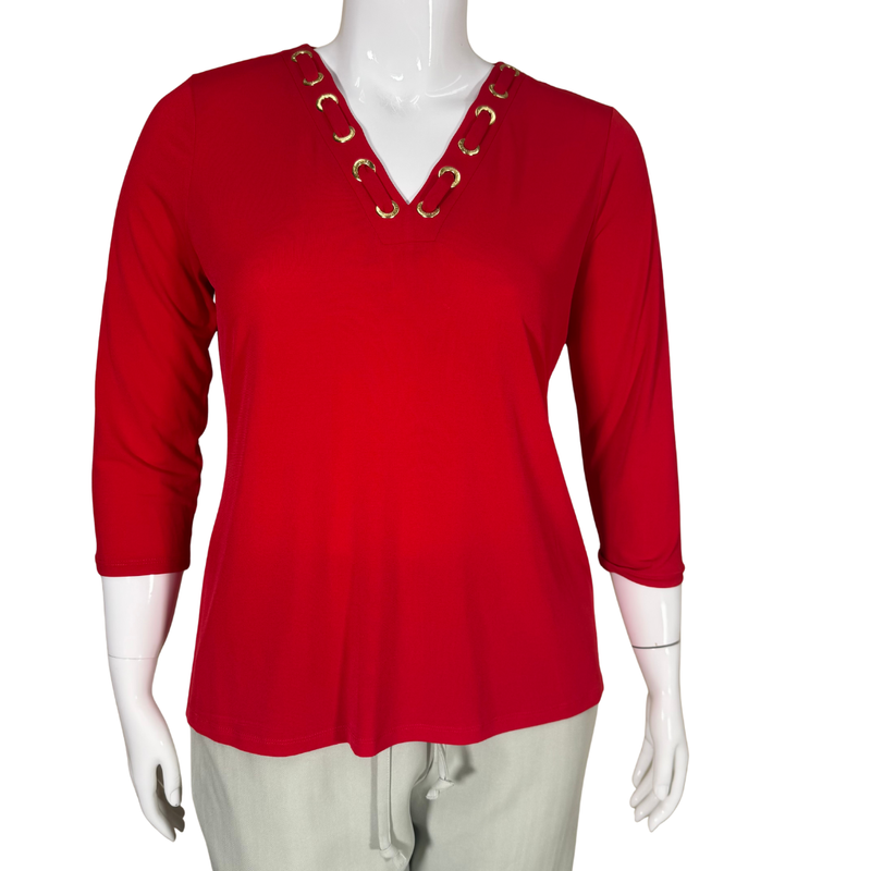 Load image into Gallery viewer, Red long-sleeve top with gold accents on a mannequin against a white background
