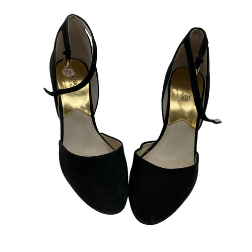 Michael Kors Black High Heels with Closed Toe are elegant black high heels with a classic design. They feature a closed, rounded toe and an adjustable ankle strap with a buckle for added comfort and support.