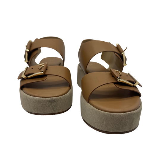 Michael Kors Colby Beige Platform Sandal offer a stylish blend of comfort and elegance.