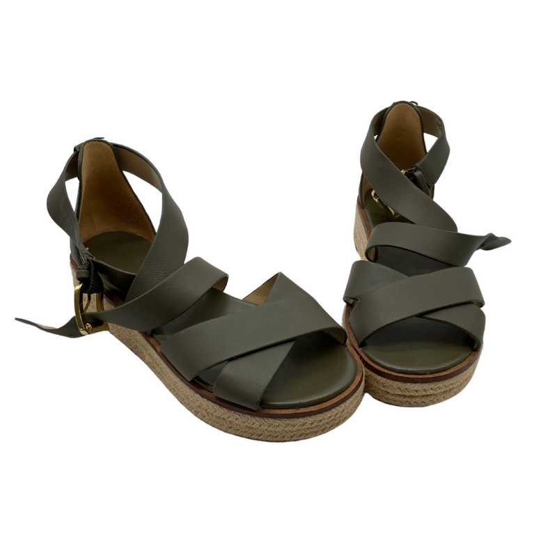 Load image into Gallery viewer, Michael Kors Dark Green Thick Strap Sandals are stylish wedge sandals featuring olive-green straps with a crossover design for a secure and modern look.
