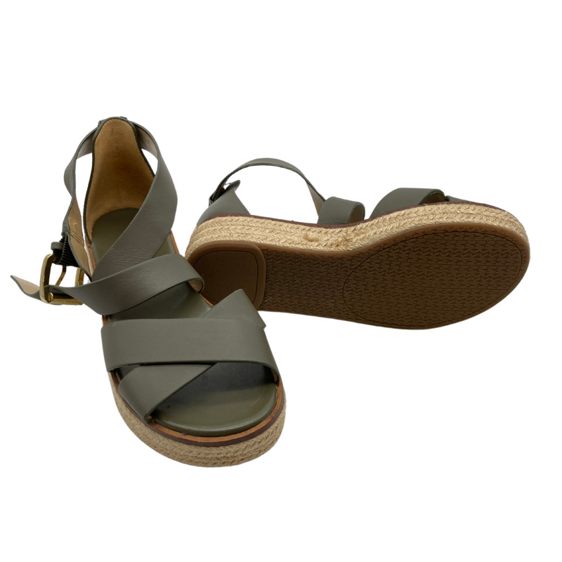 Load image into Gallery viewer, Michael Kors Dark Green Thick Strap Sandals are stylish wedge sandals featuring olive-green straps with a crossover design for a secure and modern look.
