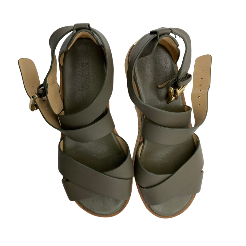 Load image into Gallery viewer, Michael Kors Dark Green Thick Strap Sandals are stylish wedge sandals featuring olive-green straps with a crossover design for a secure and modern look.
