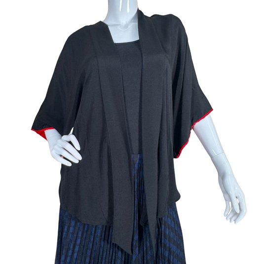 thrifted Montsuki Black Open-Front Kimono Cardigan with Red Trim. Designed with a relaxed silhouette and wide sleeves, this piece drapes beautifully for a flattering and effortless look