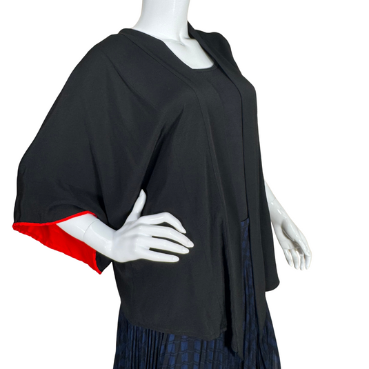 thrifted Montsuki Black Open-Front Kimono Cardigan with Red Trim. Designed with a relaxed silhouette and wide sleeves, this piece drapes beautifully for a flattering and effortless look