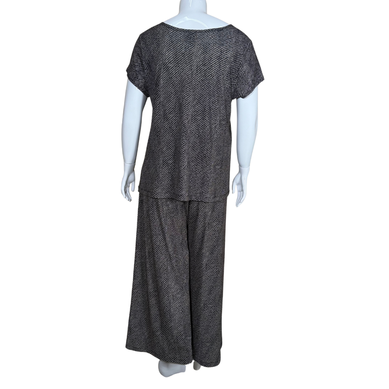 Load image into Gallery viewer, Mannequin wearing a black and white patterned outfit on a white background
