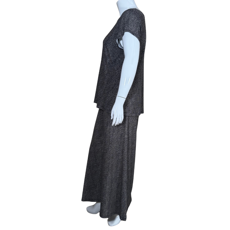 Load image into Gallery viewer, Mannequin wearing a black textured dress on a white background
