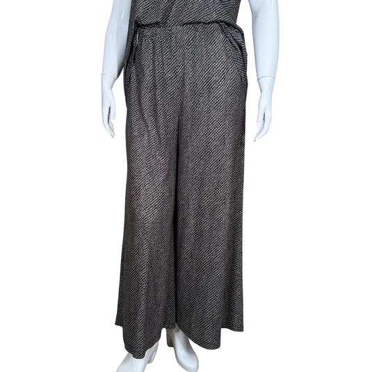 Mannequin wearing a long, patterned dress on a white background
