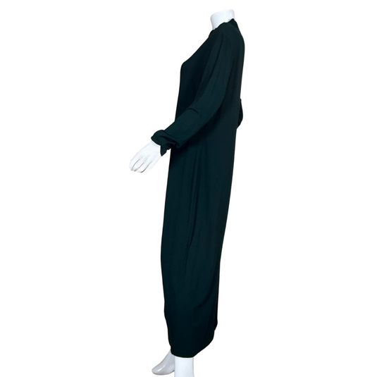  Norm Thompson Rich Dark Green Dress is designed with full-length sleeves and a modest high neckline, ideal for cooler weather or more conservative occasions