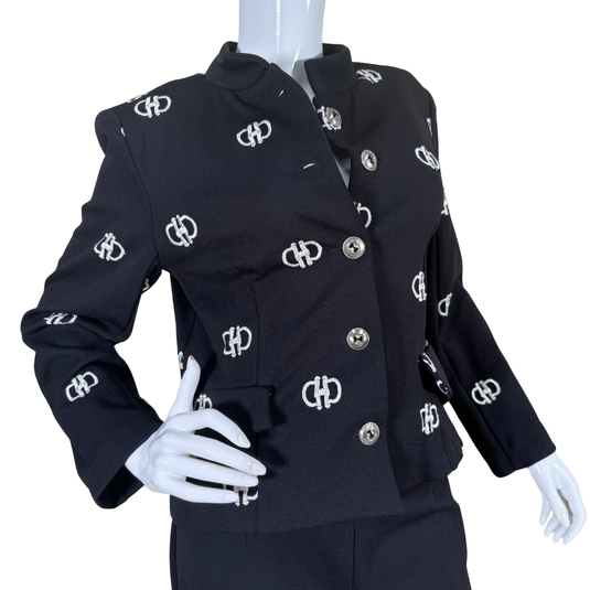 Black jacket with silver logo patterns on a mannequin against a white background