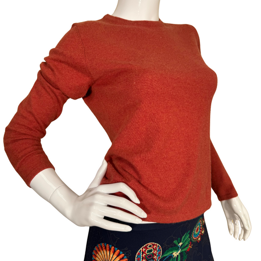 pre-loved Neiman Marcus Terra Cota Cashmere Sweater is a stylish, long-sleeve knit top in a warm, rust-red color, perfect for adding a cozy yet sophisticated touch to any wardrobe