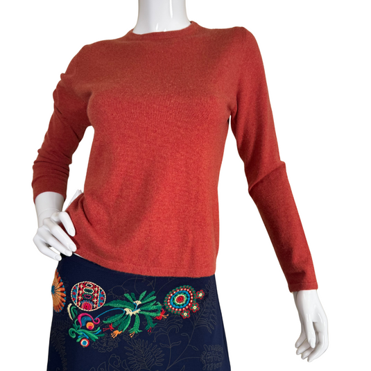 pre-loved Neiman Marcus Terra Cota Cashmere Sweater is a stylish, long-sleeve knit top in a warm, rust-red color, perfect for adding a cozy yet sophisticated touch to any wardrobe