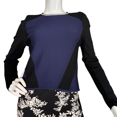  pre-loved Per Se Knit Long Sleeve Top features a dynamic colorblock design in deep navy and black with ribbed textured panels that create flattering angles along the sides and shoulders. 