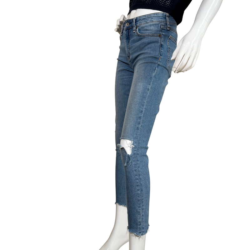 Load image into Gallery viewer, light-wash pre-loved Rag &amp; Bone High-Rise Skinny Jeans feature a trendy distressed design with a ripped knee and raw-edge hems
