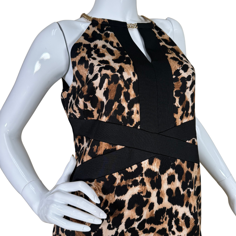 Load image into Gallery viewer, Mannequin wearing a dress with leopard print and black panels on a white background
