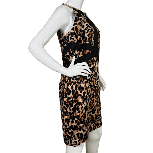  Thalia Sodi Leopard Mini Dress is designed to make a bold statement. It features a halter neckline with a chic gold chain detail, a keyhole cutout at the chest, and a black crisscross waistband that accentuates the figure.&nbsp;