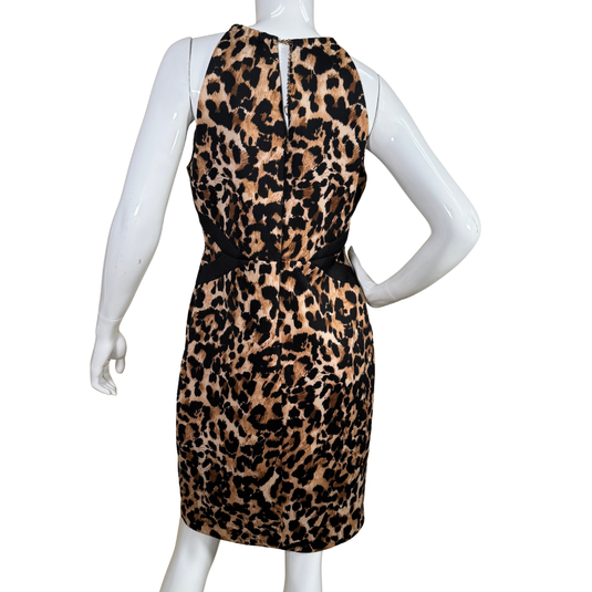 Thalia Sodi Leopard Mini Dress is designed to make a bold statement. It features a halter neckline with a chic gold chain detail, a keyhole cutout at the chest, and a black crisscross waistband that accentuates the figure.&nbsp;