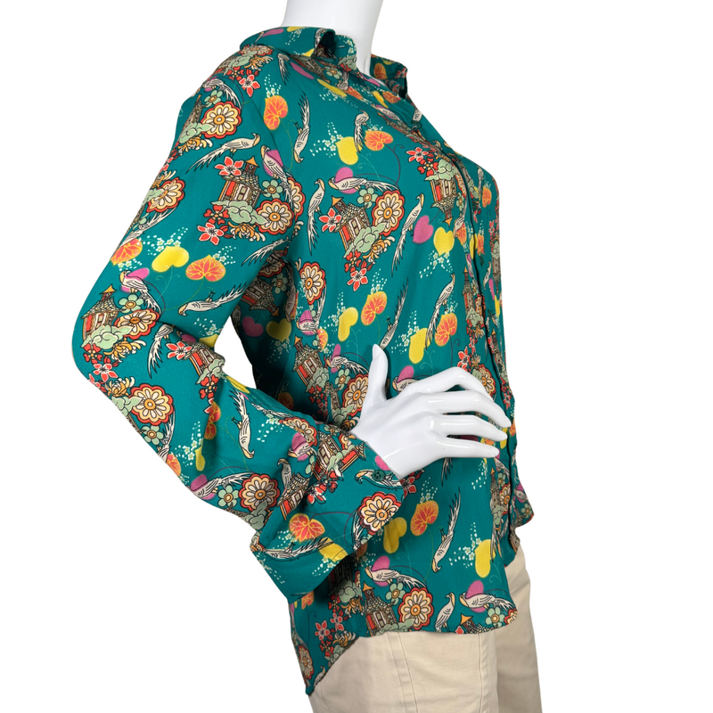 Load image into Gallery viewer, The Shirt Funky Illustrated Shirt is a vibrant long-sleeve button-up shirt features a stunning teal background adorned with an intricate Asian-inspired print - side view
